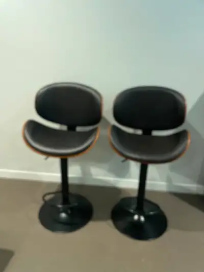 Swivel, adjustable height bar stools. They also have a foot bar for comfort. Excellent condition as...
