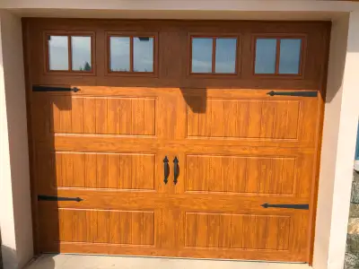 5 panels of the same colour garage door. Some dents on the inside of a couple panels during install...