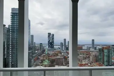 Welcome to downtown Toronto living at 88 Queen Street East. This bright condo features east–west exp...