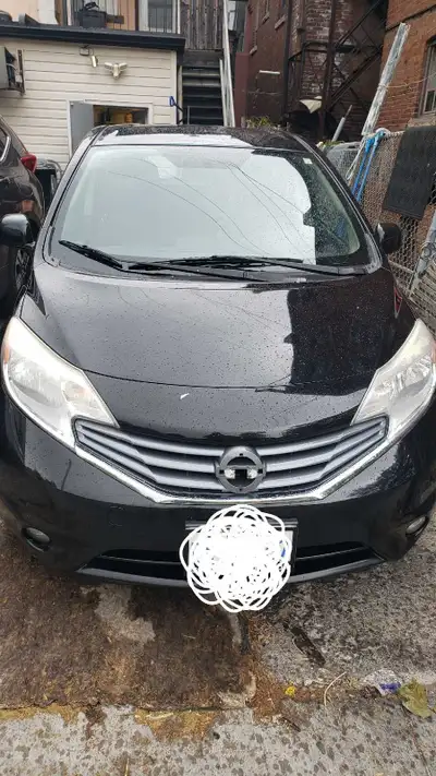 Looking for a reliable and fuel-efficient hatchback? This 2014 Nissan Versa Note SL is a great optio...