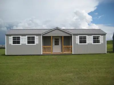 BRAND NEW 12x40 Cabin/Shed Front center deck/porch, dormer roof, walk in door and 6 windows. Awesome...