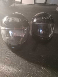 2 black helmets motorcycle/snowmobile.