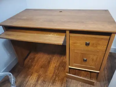 Nice desk. Has 2 drawer / letter filing cabinet hardware on bottom drawer. Extendable keyboard tray...