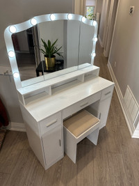 Vanity desk and chair with mirror and lights. Makeup desk