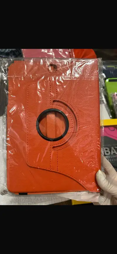 This brand new, orange tablet case with a rotating stand is perfect for your tablet, providing both...