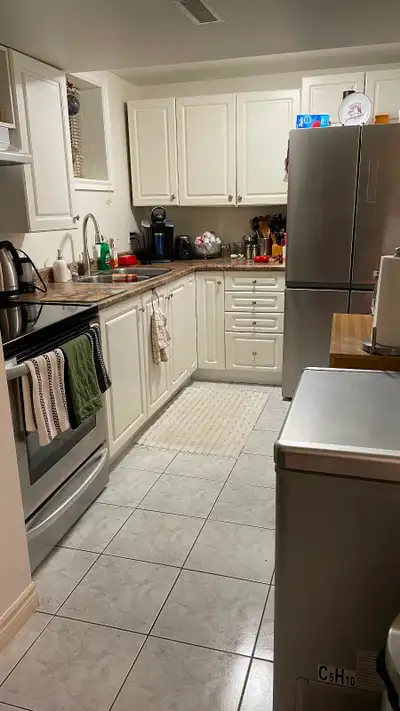 Spacious basement bedroom with separate entrance, full bathroom, and kitchen. Utilities are included...