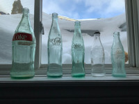 5 vintage Coca Cola bottles