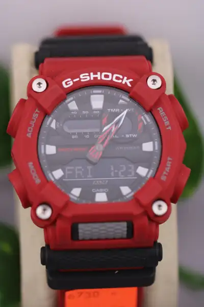 Bold and durable Casio G‑Shock GA‑900 in striking red. Features a rugged industrial design with both...