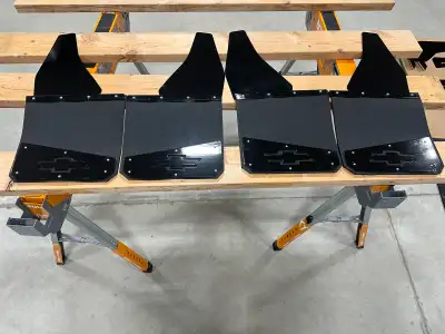 Never installed 12” kickback mudflaps powdered coated gloss black. $250 takes them. Will fit all mak...