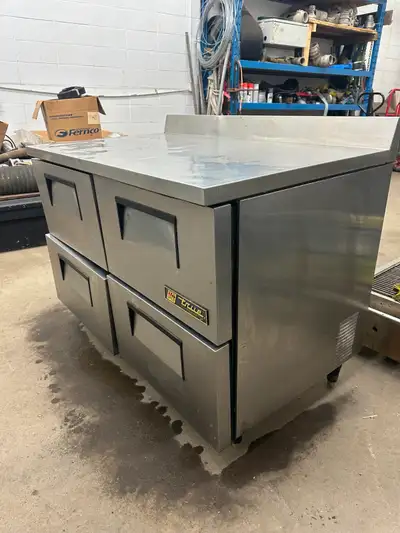 You are viewing a used True TWT-48D commercial worktop undercounter cooler with 4 drawers. There is...