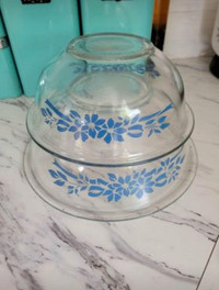 80s clear pyrex bowls with blue flowers and ribbons.