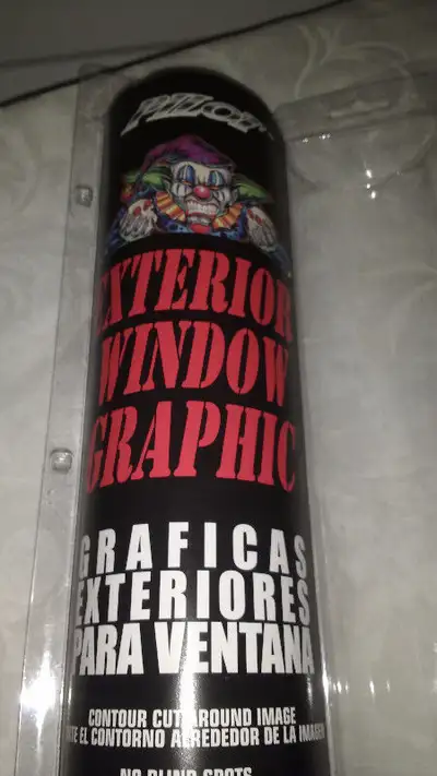 exterior window graphic sign, clown with 2 skulls, can be put on car or truck window, 16 inches by 3...