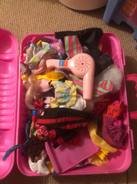 Two full suitcases of Barbie accessories