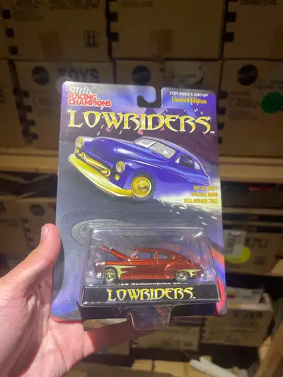 Mint card, may consider trades. Rubber tires and opening hood, premium diecast model.