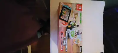 Nintendo switch comes with Mario Kart live home circuit. Legend of Zelda breath of the Wild, Legend...