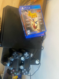 PS4 + 5 games + 2 wireless controllers + charging dock