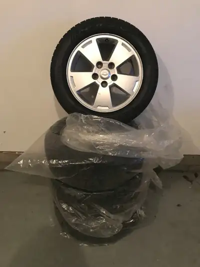 4 winter tires used one season only. Come on rims with tire pressure valves.