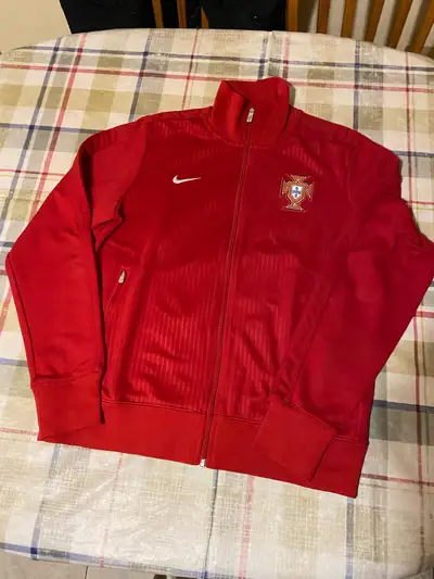 Nike Portugal Jacket, size large. I believe this is the 2014 version in red. Used, but pretty much b...