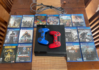 Used PS4 with 14 games and 2 controllers 