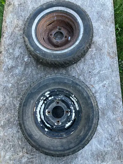 Pair of wheels from a British caravan (camping trailer) in good condition. The centre hole is approx...