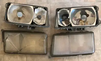 Set of original Bosch European headlights for a Mercedes Benz W124 series car. Passenger side lens i...