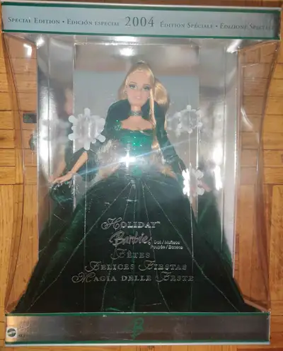 This Mattel 2004 Holiday Barbie Special Edition doll is new in box! This beautiful doll features a s...