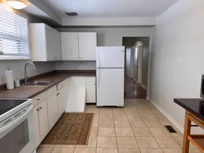 Main level of a well maintained bungalow with large windows in a quiet mature area near Kennedy Rd a...