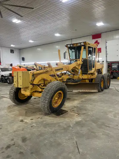 1989 Champion 740 Grader, L10 Cummins, a/c, winter tires, has ripper. Located by Kindersley, Sask. C...