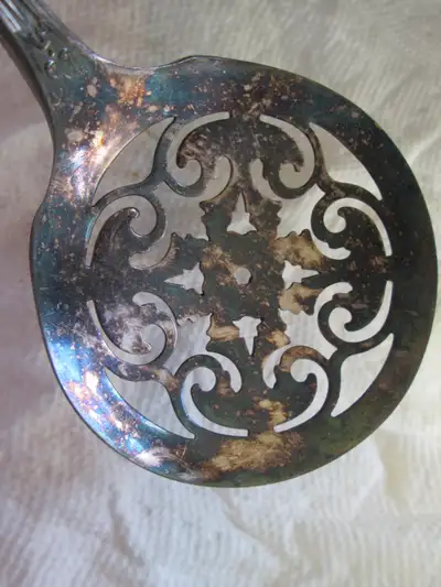 1881 Rogers A1 it also says, patented, it's a silver plated kitchen tool, it's fancy