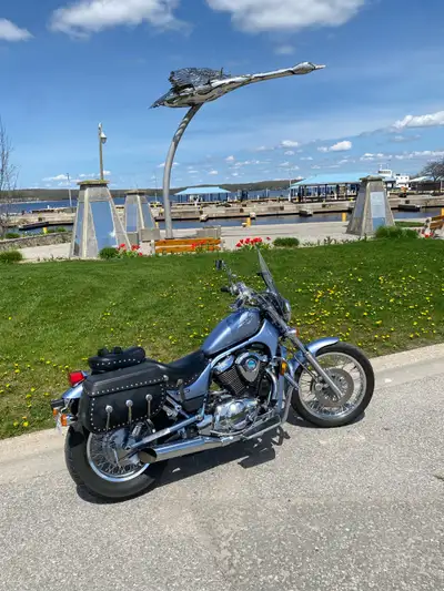 This bike is in new condition. Has mustang seat upgrade,crash bar, hwy pegs, bags that match seat, f...