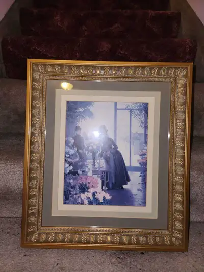 Lovely picture of a lady in a flower shop. Ornate wood frame in great condition. Frame size: 14.5" x...
