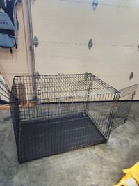 Cage pour chien     ( grande) tres bonne condition