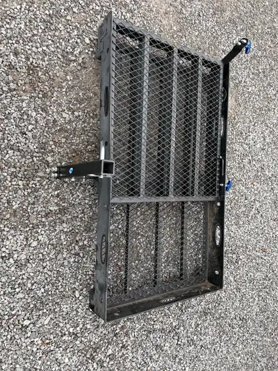 Hitch-Mounted Folding Steel Carrier I am offering a carrier that attaches to a vehicle's trailer hit...