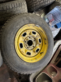 Four Camaro rims and tires 