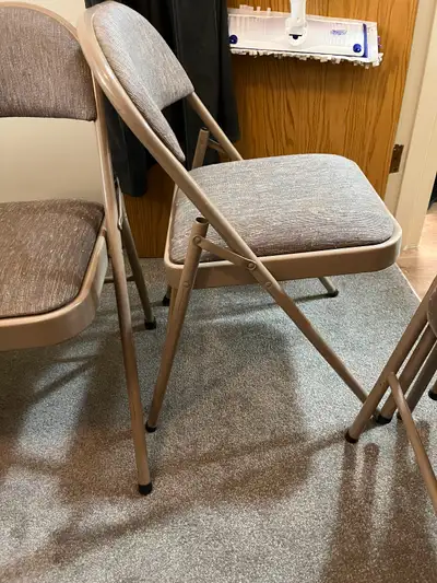 4 Padded folding stackable chairs….. these chairs are padded on the bottom and back and are very com...