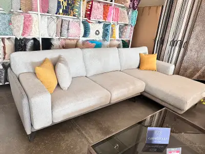 This two-colour fabric sectional sofa features a modern, stylish design with a combination of contra...