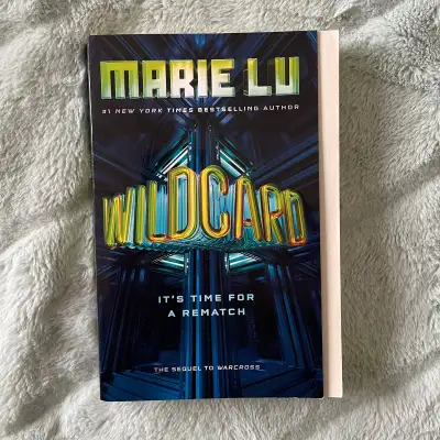 Wildcard, the sequel to sci-fi thriller Warcross by bestselling author Marie Lu. A popular read for...