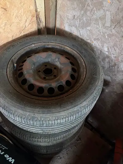 Chevy Cruze tires/rims. 215/ 60/R16 Michelin premier All seasons Good for awhile yet 80$