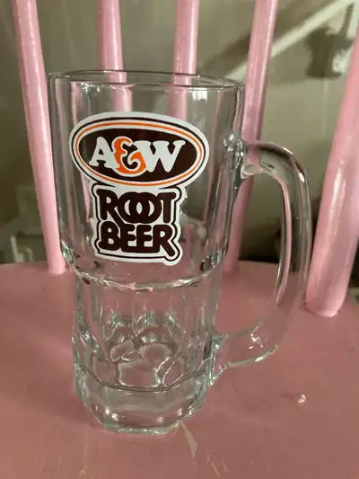 This is an A&W Root Beer mug, perfect for enjoying your favourite beverage in style. This mug is in...