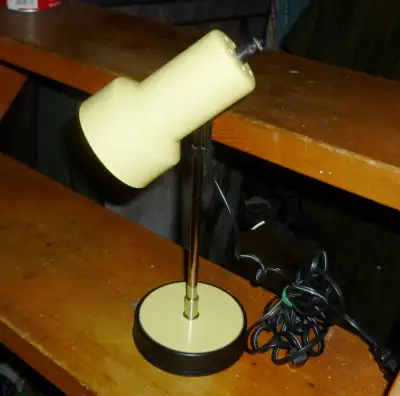 Mid century modernistic, made in Italy. Head can swivel up and down. Drafting style lamp, 12" tall.