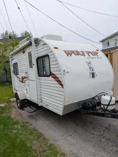2011 wolf pup trailer with motorcycle rack on the back. Was used for 3 years for dry camping once a...