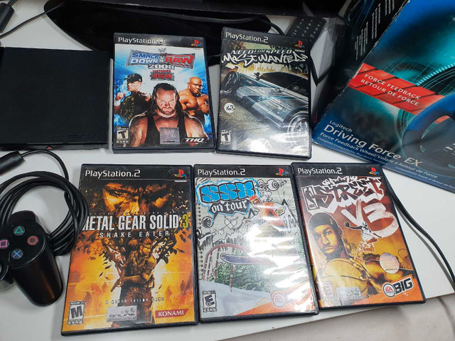Sony PlayStation 2 slim,5 jeux,2 manettes,volant  dans Consoles classiques  à Ville de Montréal - Image 3