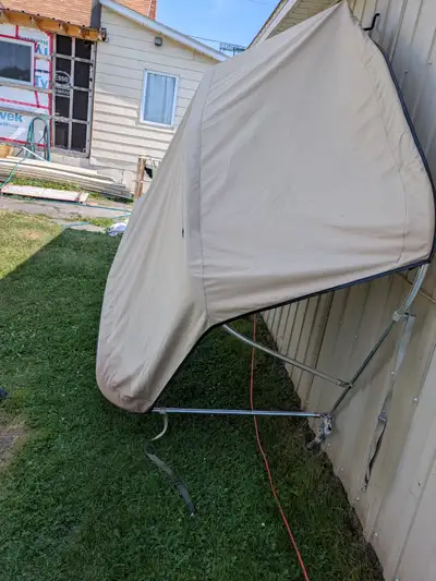 The bimini top is clean and nice with no tear. PU in North Lancaster. Thanks