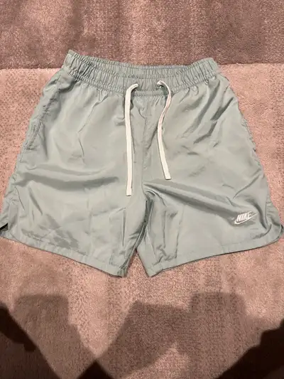 Nike XS men’s swim trunks, View more