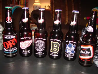 VINTAGE HOCKEY PAINTED BEER BOTTLES, View more