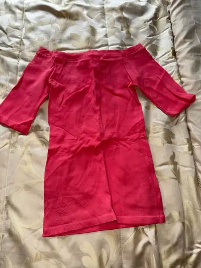Cute coral mini dress. Off-the-shoulder neckline. Three-quarter sleeves. Ribbed material. Perfect fo...
