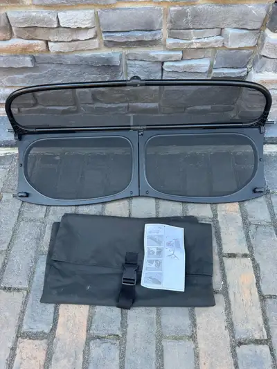 I am selling a Mini Cooper convertible wind deflector that will greatly reduce the wind turbulence i...