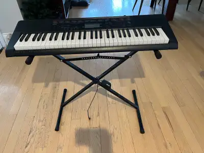 The Casio LK-160 is a 61-key electronic keyboard designed for beginners, featuring an interactive ke...