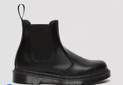 Step into style with these Dr. Martens Chelsea Boots, a timeless classic with a modern edge. These b...