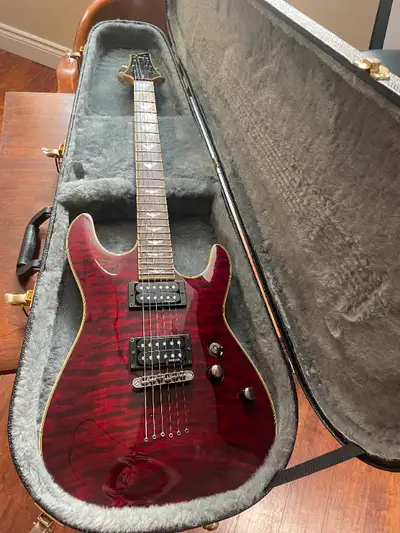 Beautiful Schecter Omen Extreme 6 Diamond Series guitar in Black Cherry with a quality hardshell cas...